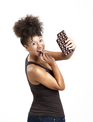 Image showing Woman eating chcolate