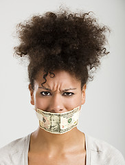 Image showing Covering mouth with a dollar banknote