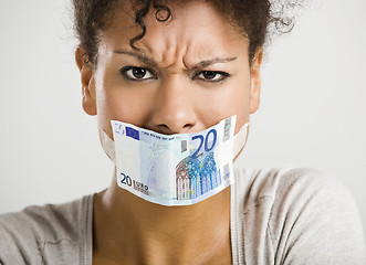 Image showing Covering mouth with a euro banknote