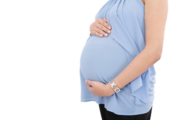 Image showing Image of pregnant woman touching her belly with hands isolated o