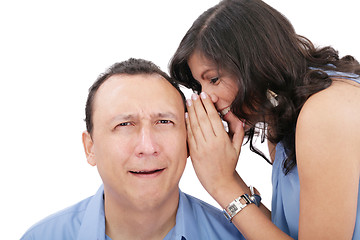 Image showing Beautiful brunette woman whispering into her boyfriends ear 