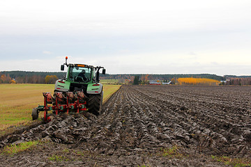 Image showing Tractor Ploughing a Field in Autumn