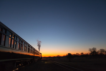 Image showing Train into sunset