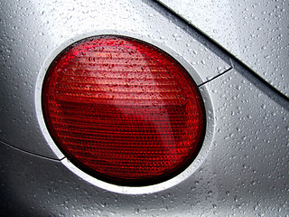 Image showing Rear car light and water dew drops