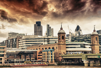 Image showing City of London at sunset, financial center and Canary Wharf at t