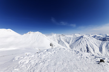 Image showing Winter snowy mountains and blue sky