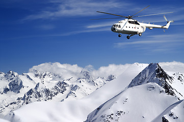 Image showing Helicopter in winter mountains