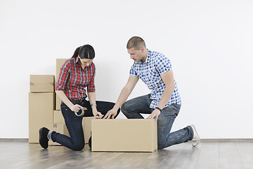 Image showing Young couple moving in new home