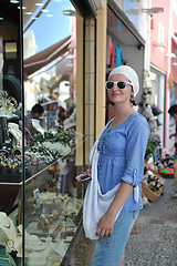 Image showing Greek woman on the streets of Oia, Santorini, Greece