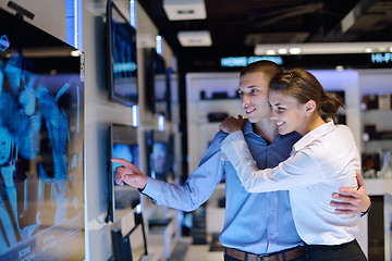 Image showing Young couple in consumer electronics store