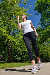 Image showing Young beautiful  woman jogging