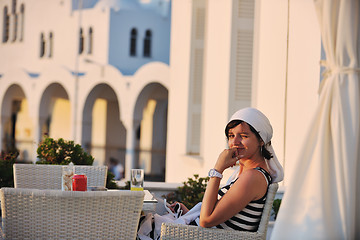 Image showing Greek woman on the streets of Oia, Santorini, Greece