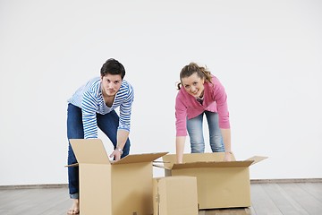 Image showing Young couple moving in new home