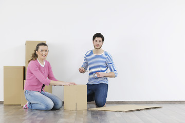 Image showing Young couple moving in new home