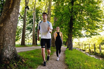 Image showing Young couple jogging