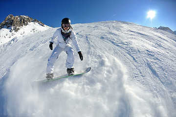 Image showing skiing on fresh snow at winter season at beautiful sunny day