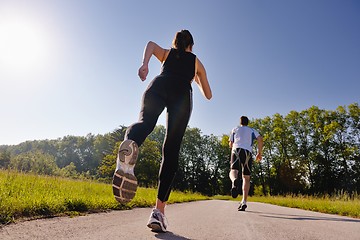 Image showing Young couple jogging