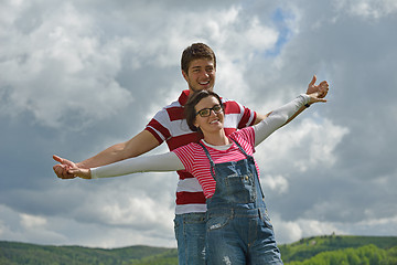 Image showing Portrait of romantic young couple smiling together outdoor