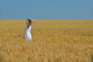 Image showing young woman in wheat field at summer