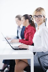 Image showing business woman group with headphones