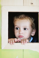 Image showing happy child in a window