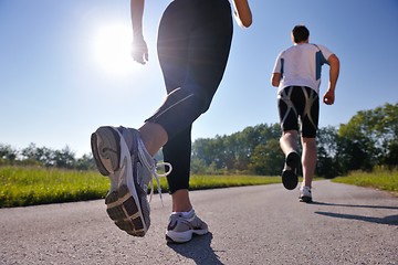 Image showing Young couple jogging