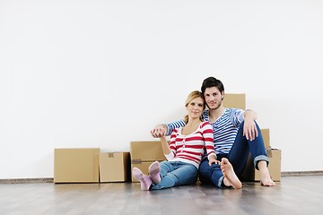 Image showing Young couple moving in new house