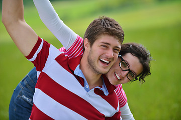 Image showing Portrait of romantic young couple smiling together outdoor