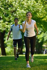 Image showing Young couple jogging