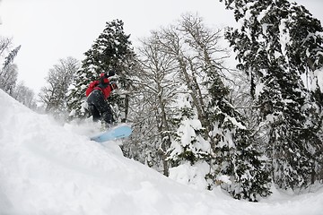 Image showing snowboarder on fresh deep snow