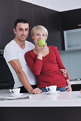 Image showing young couple have fun in modern kitchen