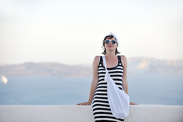 Image showing Greek woman on the streets of Oia, Santorini, Greece