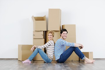 Image showing Young couple moving in new house