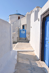 Image showing Greek woman on the streets of Oia, Santorini, Greece