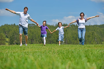 Image showing happy young family have fun outdoors