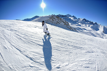 Image showing skiing on fresh snow at winter season at beautiful sunny day