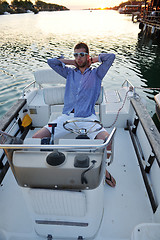 Image showing portrait of happy young man on boat