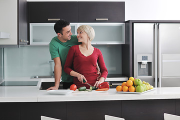 Image showing young couple have fun in modern kitchen