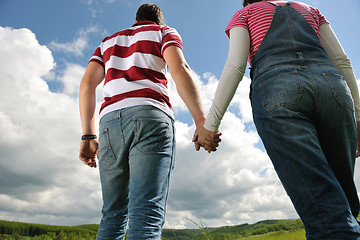 Image showing Portrait of romantic young couple smiling together outdoor