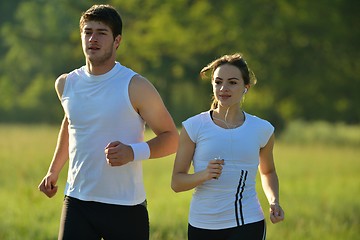 Image showing Young couple jogging