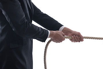 Image showing business man with rope isolated on white background