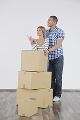 Image showing Young couple moving in new home