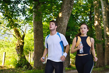 Image showing Young couple jogging