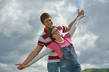 Image showing Portrait of romantic young couple smiling together outdoor