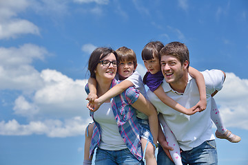 Image showing happy young family have fun outdoors