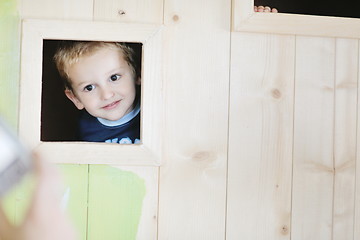 Image showing happy child in a window