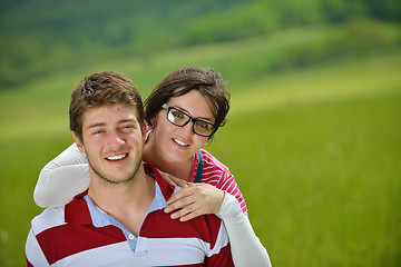 Image showing Portrait of romantic young couple smiling together outdoor