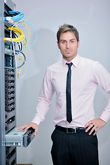 Image showing young it engineer in datacenter server room