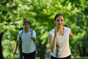 Image showing Young couple jogging