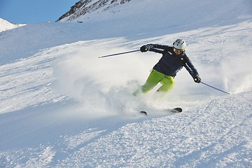 Image showing skiing on fresh snow at winter season at beautiful sunny day